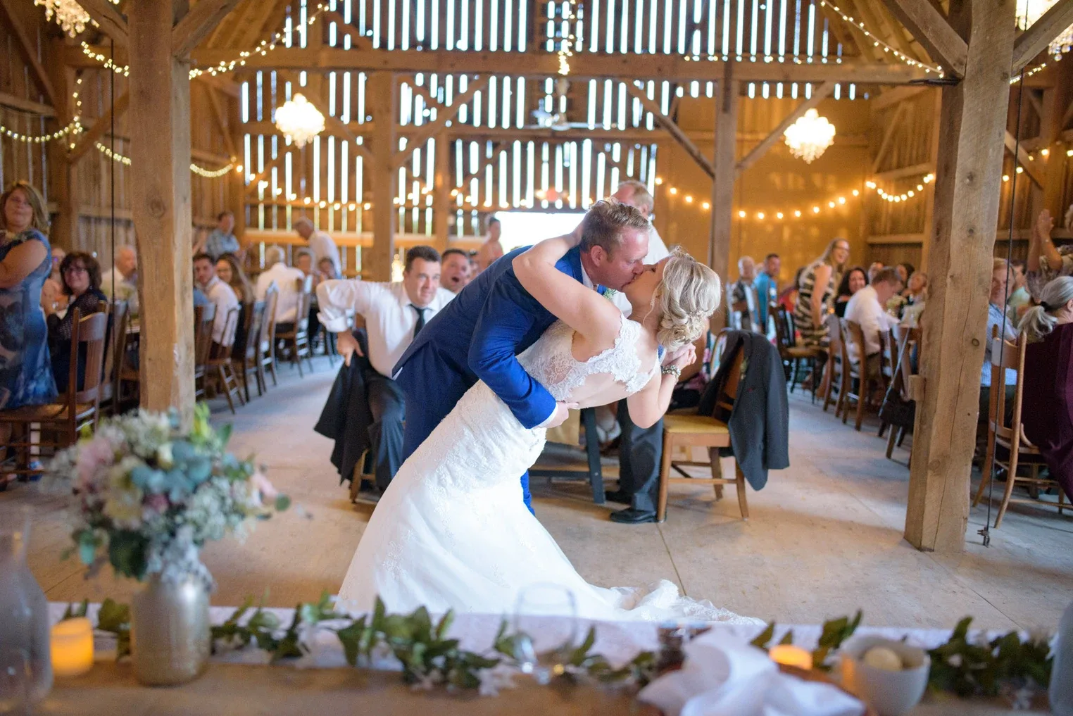Guests celebrating a wedding reception at The Barns of Lost Creek in Beldenville, Wisconsin